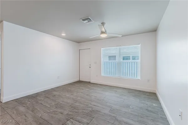 a view of an empty room with a window