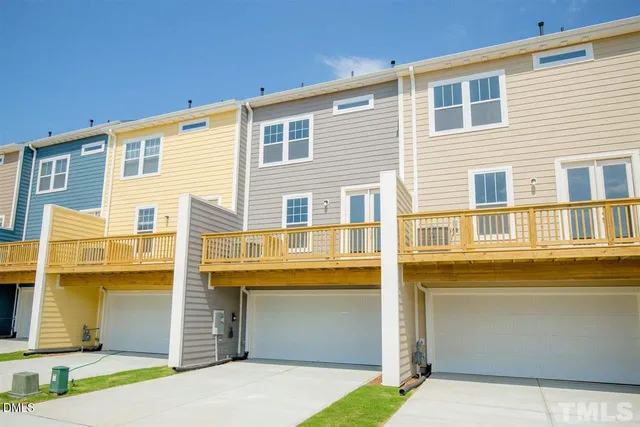 a front view of a house with a garage