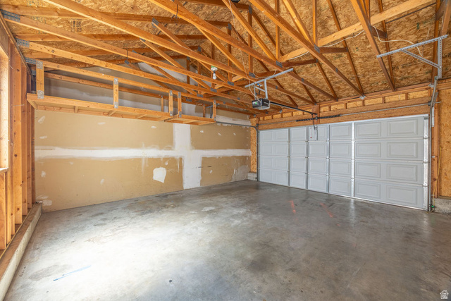 2 West 1780 North Logan, UT 84341 - Photo 16 of 24 Garage featuring a garage door opener