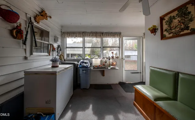 a kitchen with sink and refrigerator