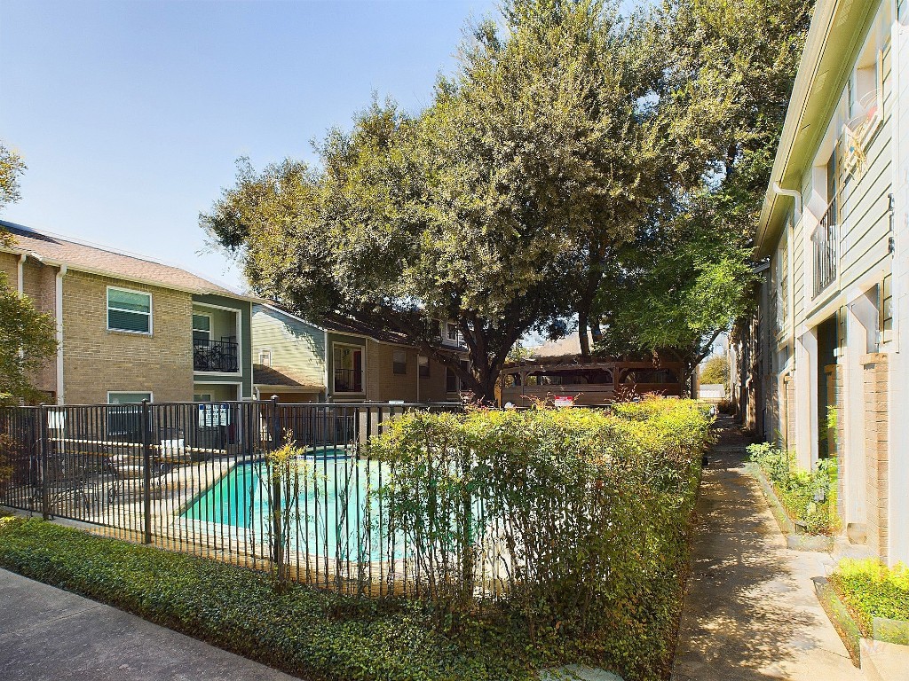 2104 Cullen Avenue, Unit 4117 Austin, TX 78757 - Photo 13 of 36 a view of a house with a small yard and plants