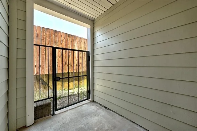 a bedroom with a bed and a mirror