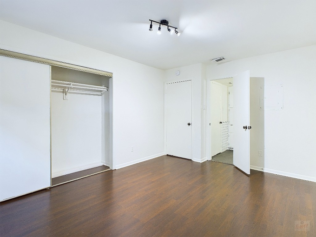 2104 Cullen Avenue, Unit 4117 Austin, TX 78757 - Photo 5 of 36 wooden floor in an empty room