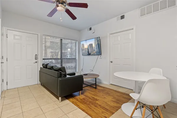 a living room with furniture and a window