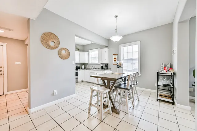 a view of a dining room and kitchen