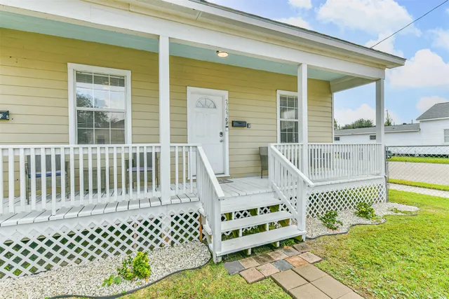 a front view of a house with a chairs