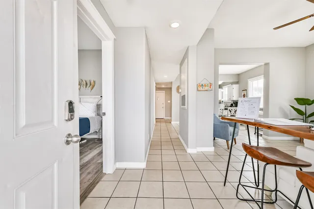 a view of kitchen with furniture and refrigerator