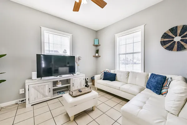 a living room with furniture and a flat screen tv