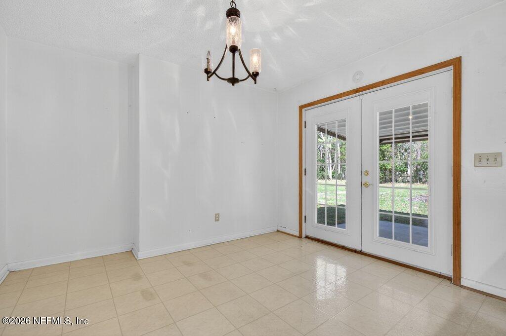 5785 George Hodges Road Macclenny, FL 32063 - Photo 18 of 55 a view of an empty room with a window