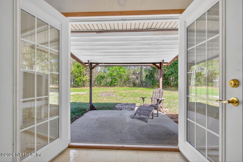 5785 George Hodges Road Macclenny, FL 32063 - Photo 21 of 55 a view of a house with a big yard and balcony