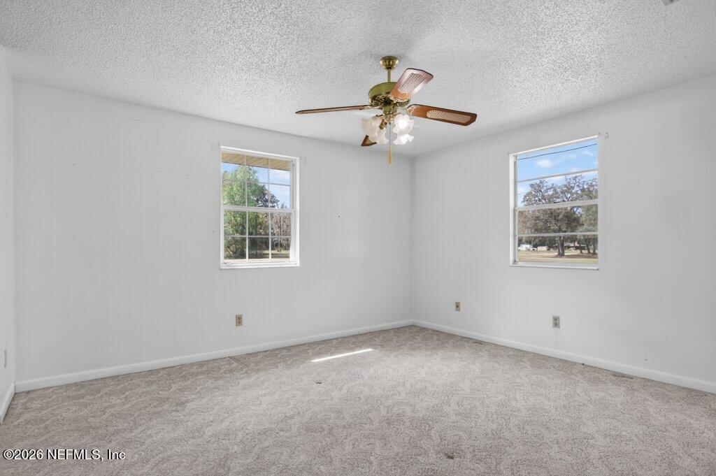 5785 George Hodges Road Macclenny, FL 32063 - Photo 37 of 55 a view of an empty room with a window