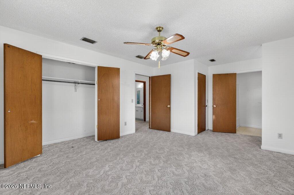 5785 George Hodges Road Macclenny, FL 32063 - Photo 38 of 55 a view of an empty room with a ceiling fan