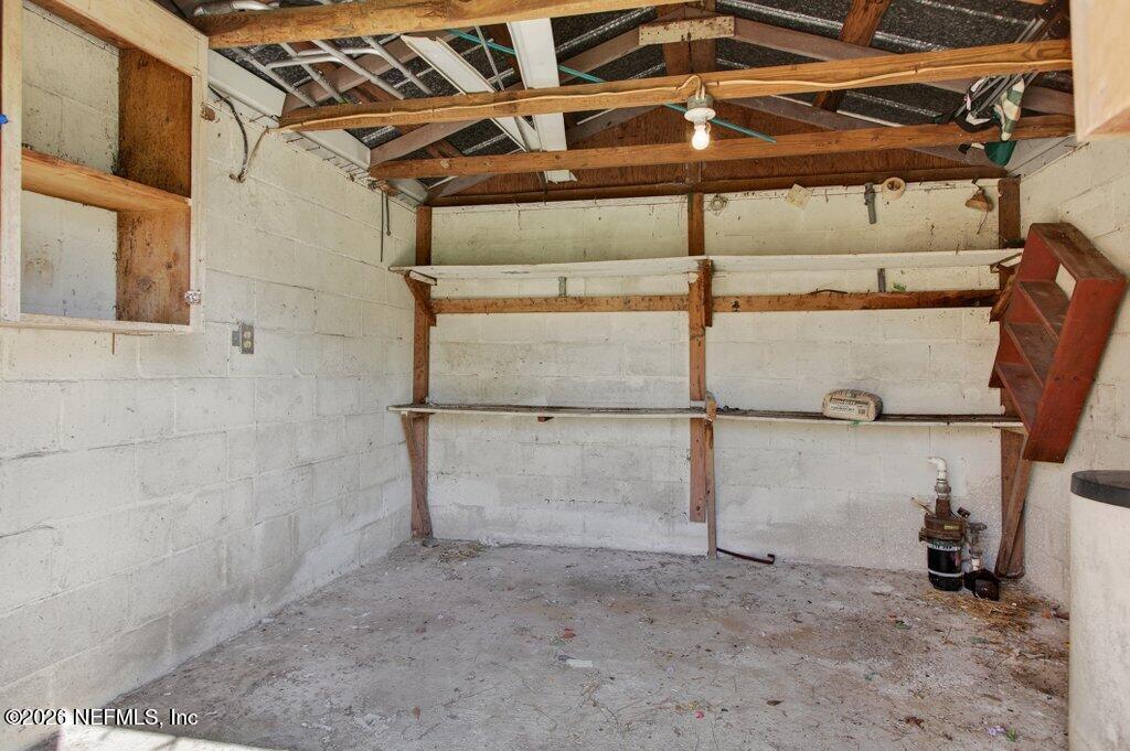 5785 George Hodges Road Macclenny, FL 32063 - Photo 47 of 55 a view of a room with racks on the wall
