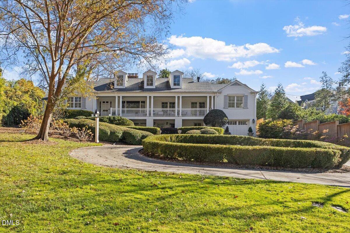 2416 East Lake Drive Raleigh, NC 27609 - Photo 2 of 42 a front view of a house with swimming pool table and chairs