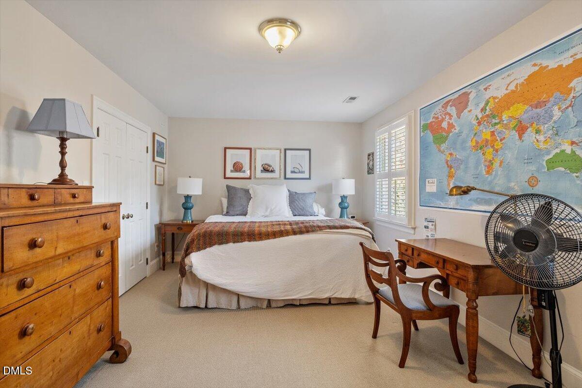 2416 East Lake Drive Raleigh, NC 27609 - Photo 29 of 42 a bedroom with a bed and furniture