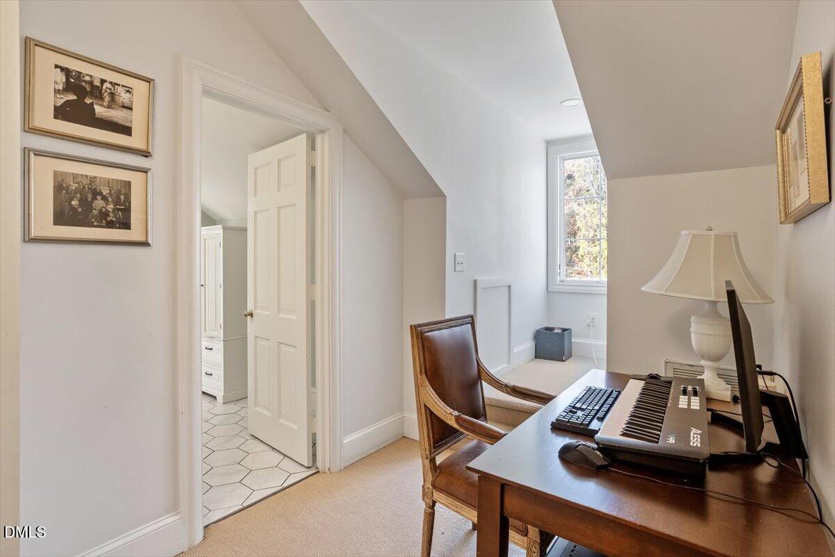 2416 East Lake Drive Raleigh, NC 27609 - Photo 32 of 42 a view of a workspace with furniture and a window