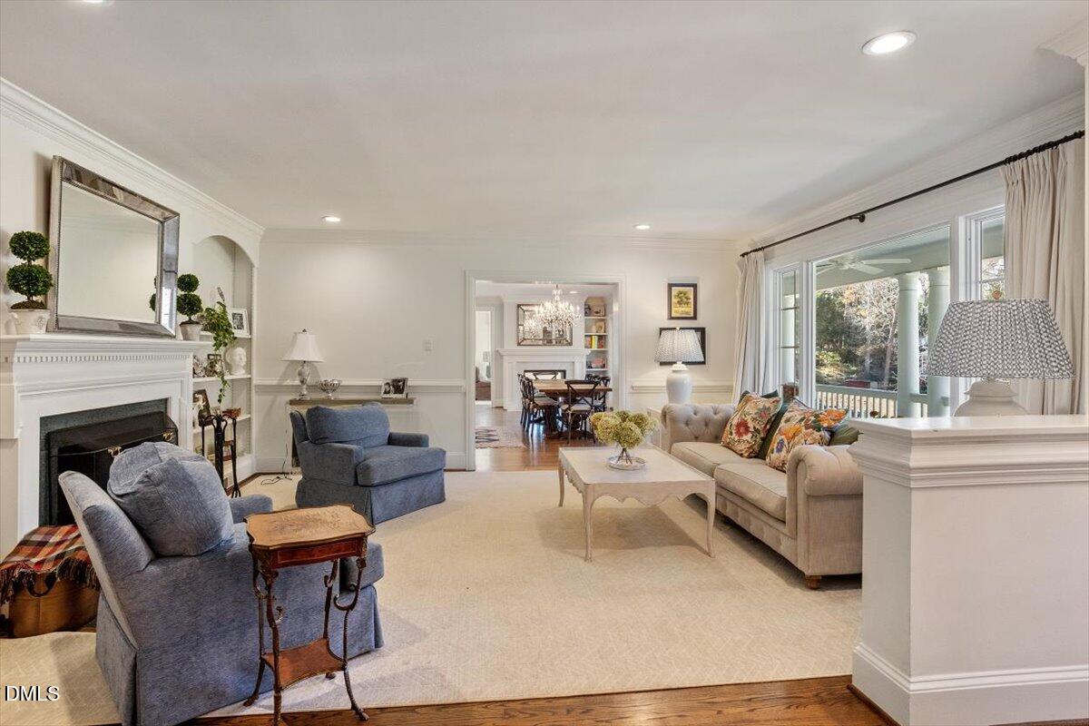 2416 East Lake Drive Raleigh, NC 27609 - Photo 6 of 42 a living room with fireplace furniture and a large window