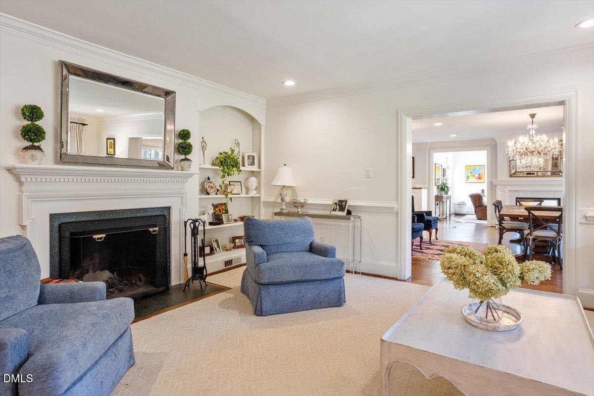 2416 East Lake Drive Raleigh, NC 27609 - Photo 7 of 42 a living room with furniture and a fireplace