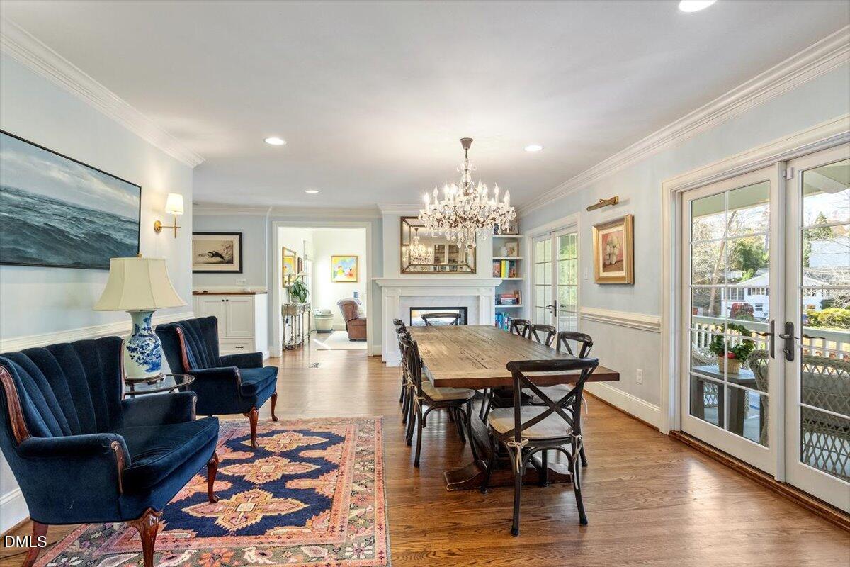 2416 East Lake Drive Raleigh, NC 27609 - Photo 8 of 42 a view of a dining room with furniture window and wooden floor