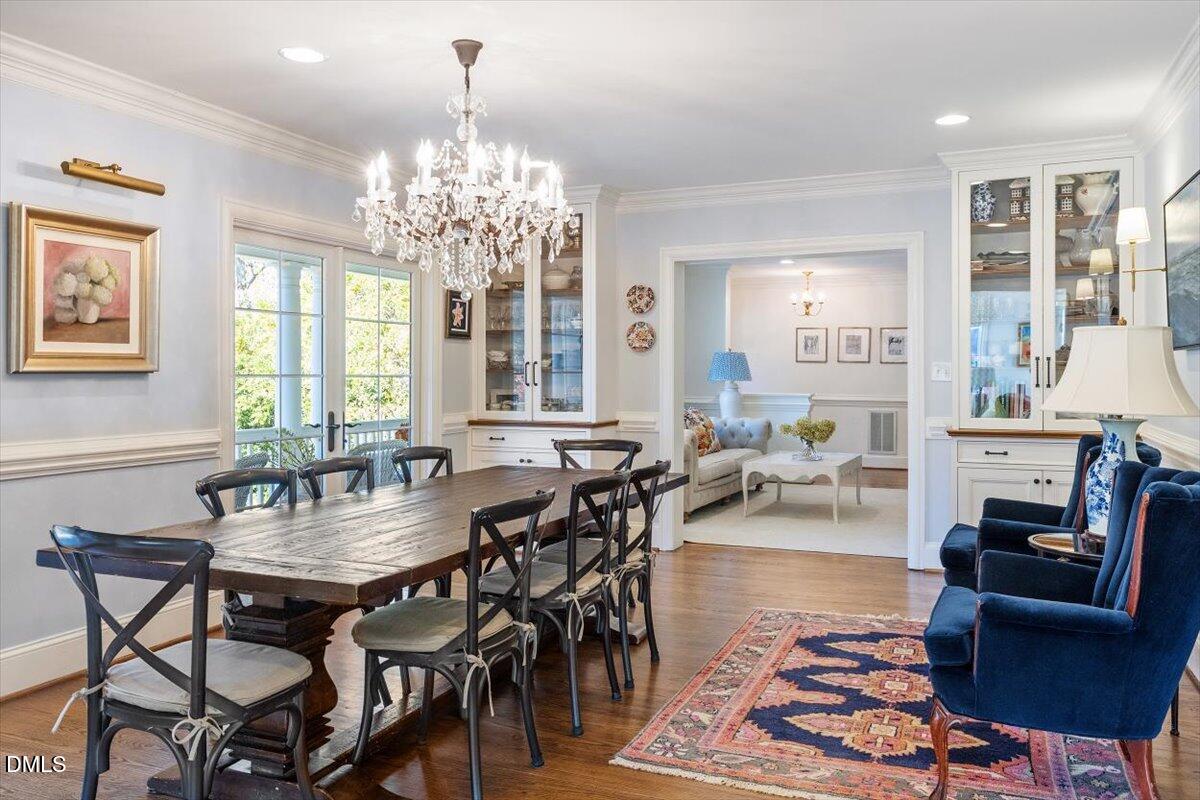2416 East Lake Drive Raleigh, NC 27609 - Photo 10 of 42 a view of a dining room with furniture window and outside view