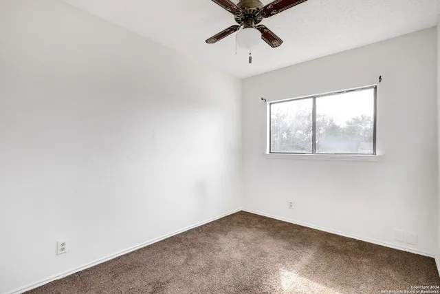 a bathroom with a sink a toilet a mirror and bathtub