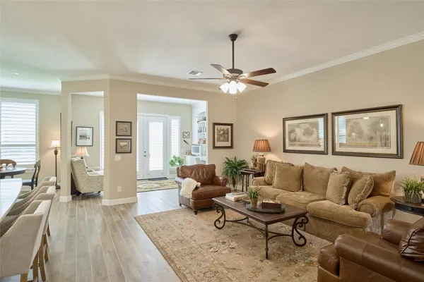 a kitchen with stainless steel appliances kitchen island granite countertop a sink a stove and a refrigerator
