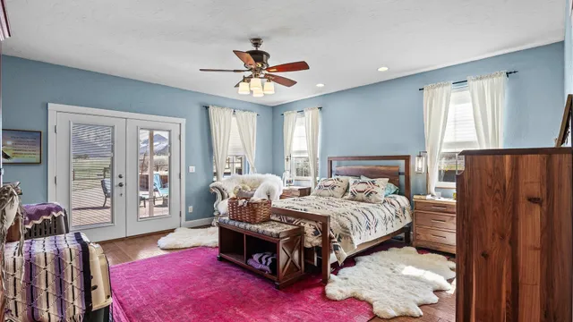 a bedroom with a bed couch and window