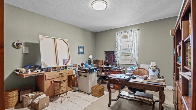 a room with gym equipment and a window