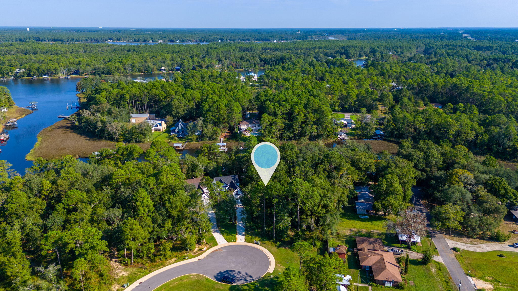 Lot 17 Redfish Point Drive Freeport, FL 32439 - Photo 5 of 9 a aerial view of a house with a yard and lake view