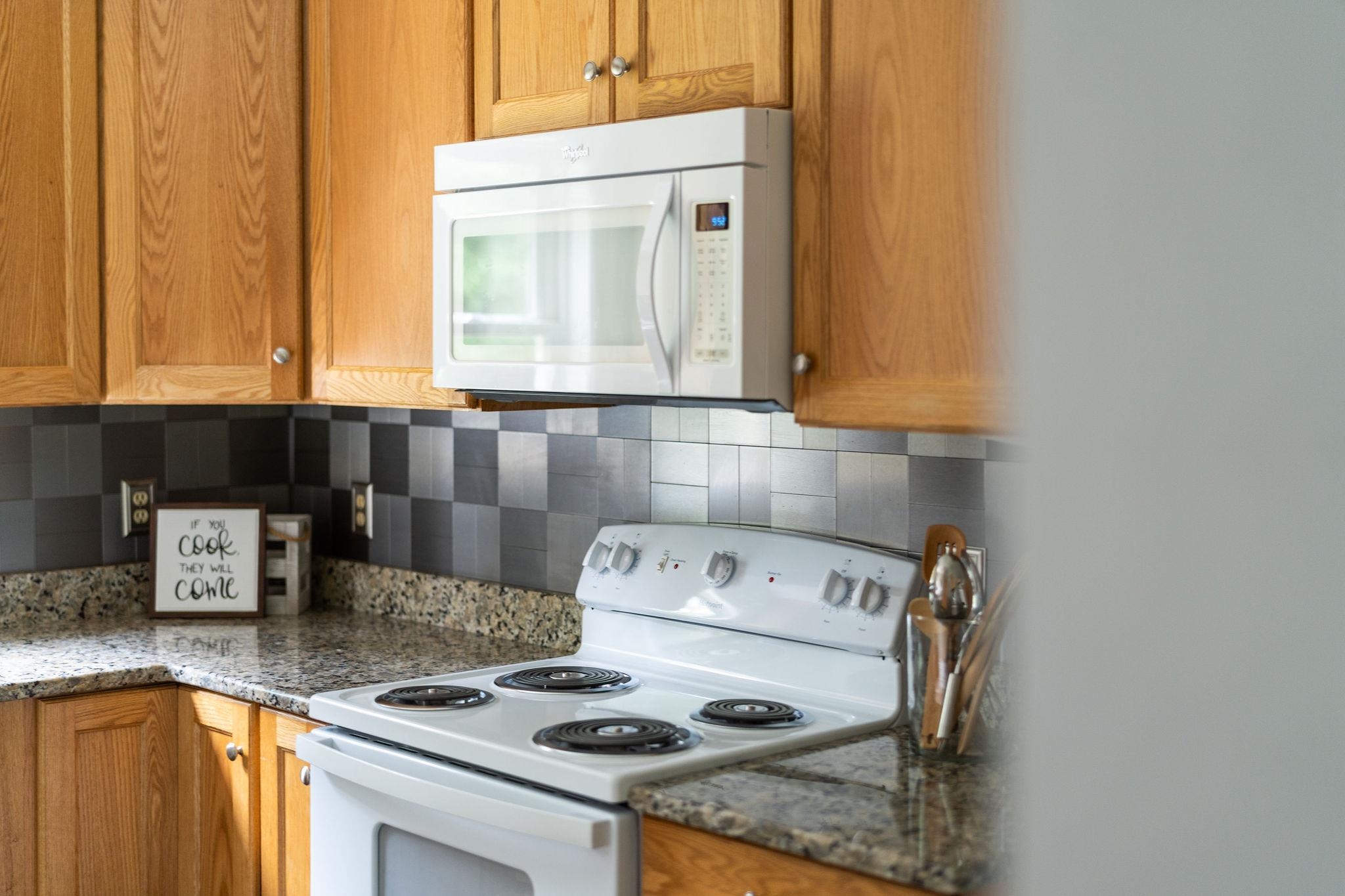 5264 Cold Springs Road Raphine, VA 24472 - Photo 13 of 57 a kitchen with a stove and a microwave
