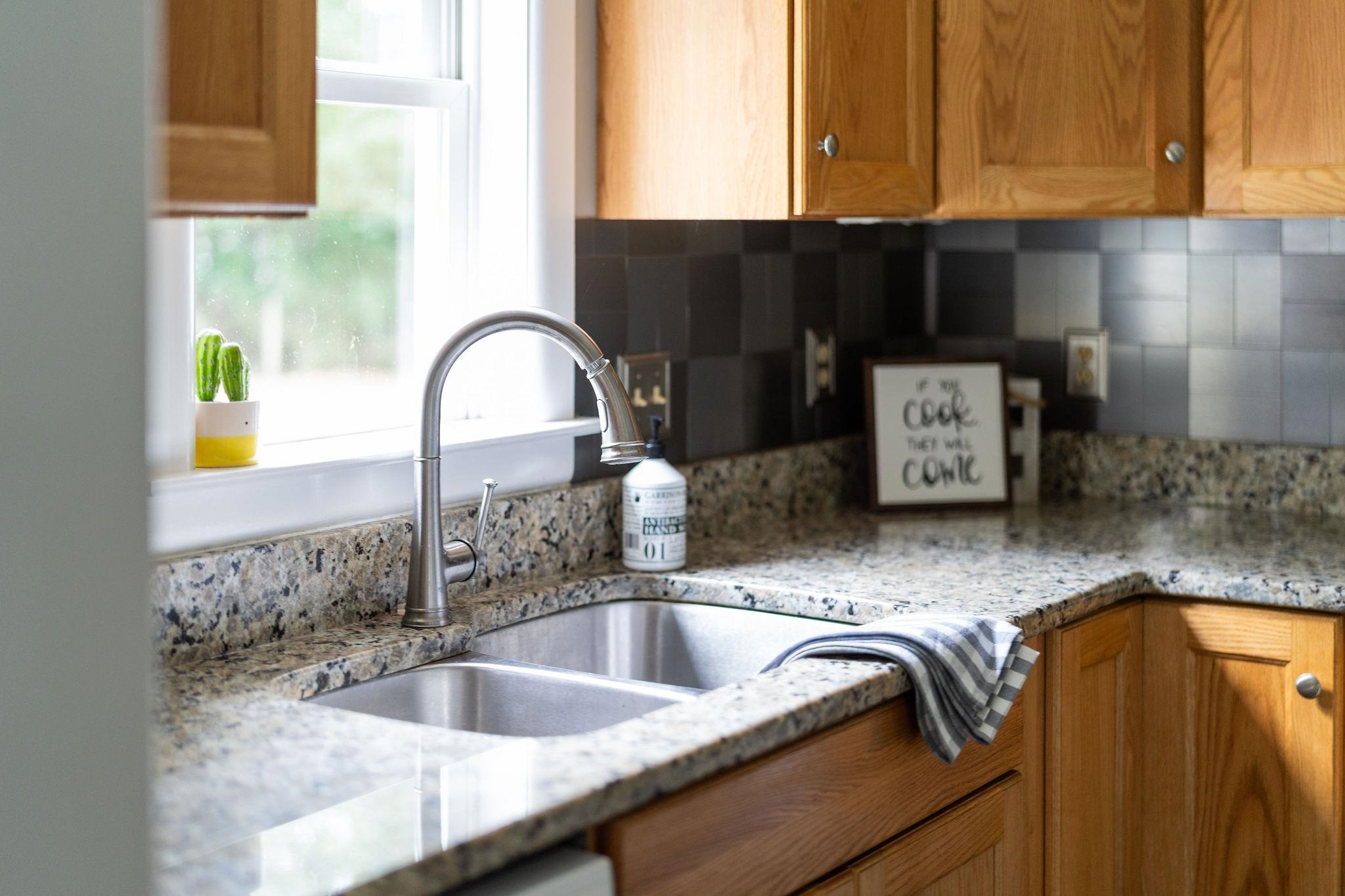 5264 Cold Springs Road Raphine, VA 24472 - Photo 17 of 57 a kitchen with granite countertop a sink and a window