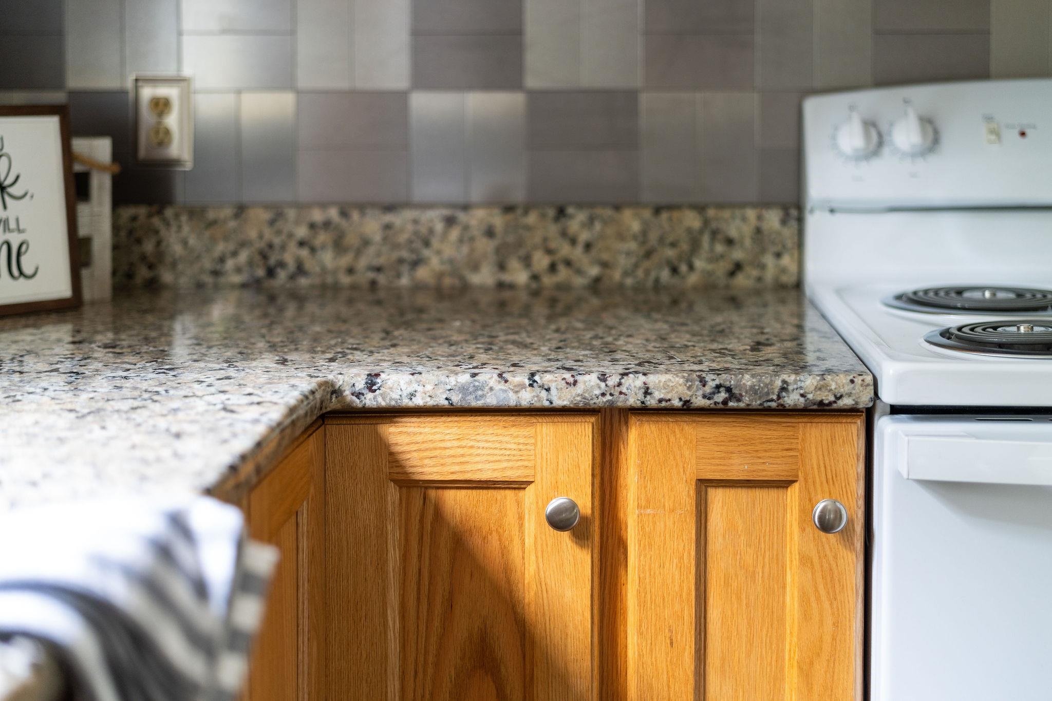 5264 Cold Springs Road Raphine, VA 24472 - Photo 20 of 57 a bathroom with a granite countertop sink and washing machine