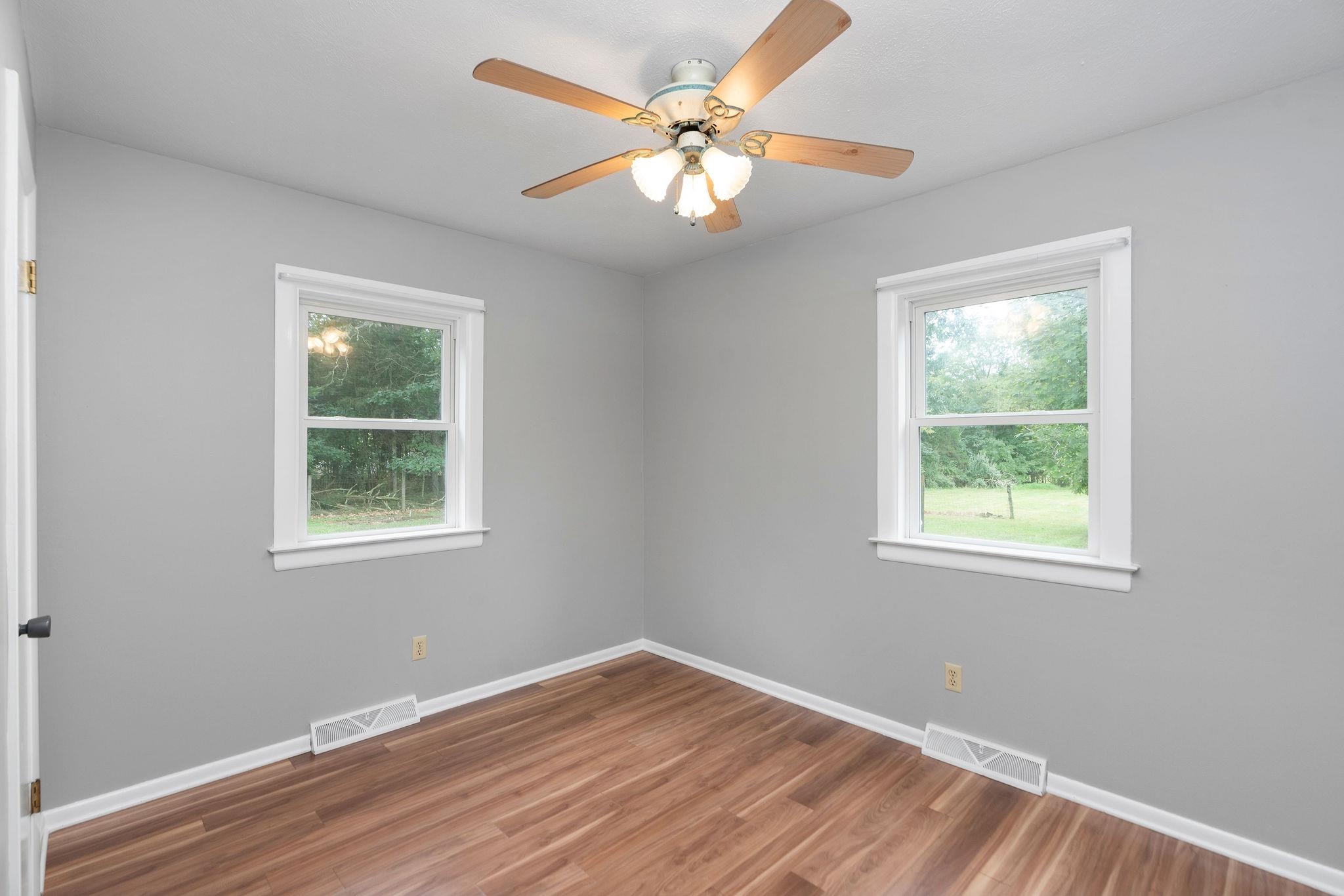 5264 Cold Springs Road Raphine, VA 24472 - Photo 27 of 57 a view of an empty room with wooden floor and a window