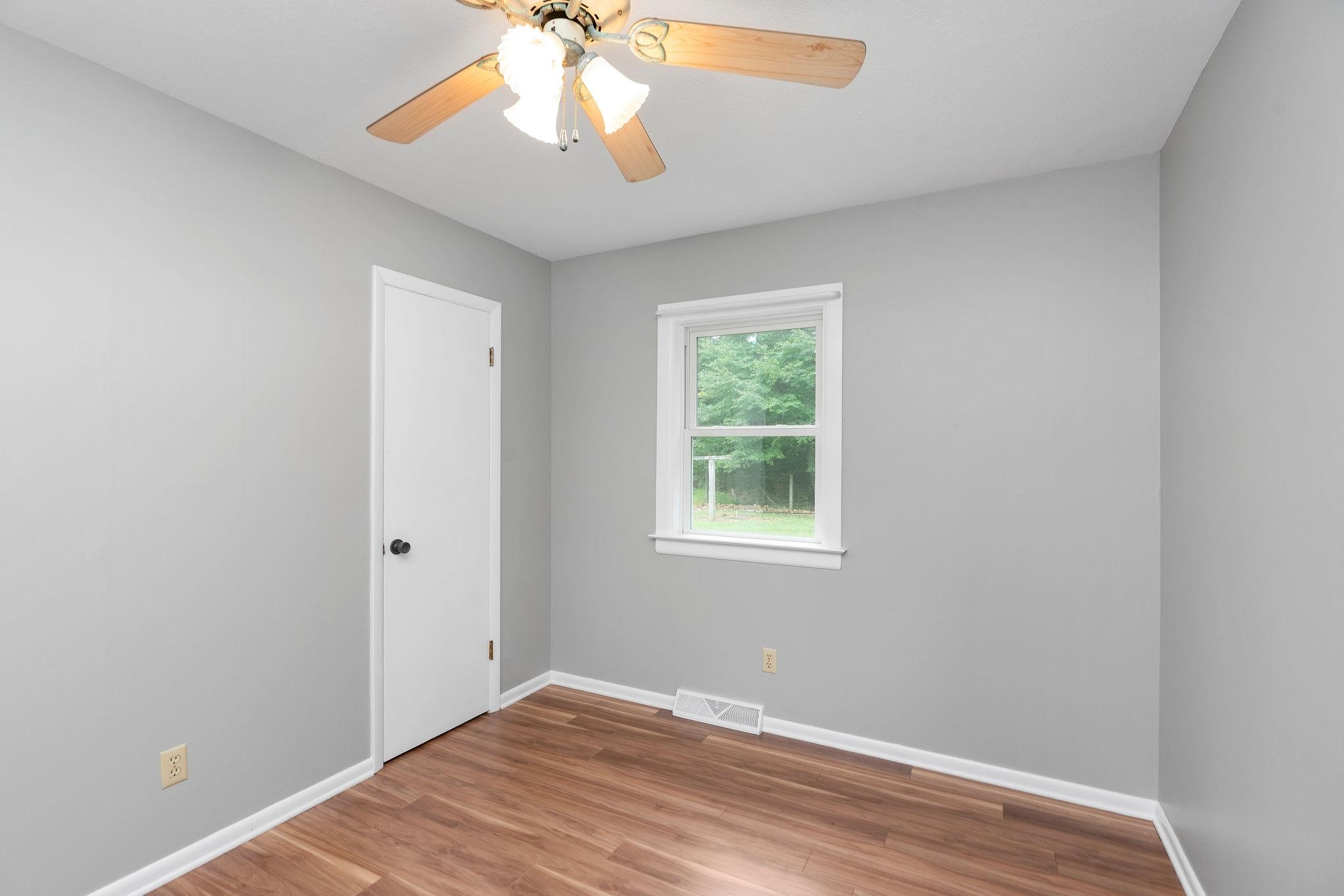 5264 Cold Springs Road Raphine, VA 24472 - Photo 28 of 57 an empty room with a window and a fan
