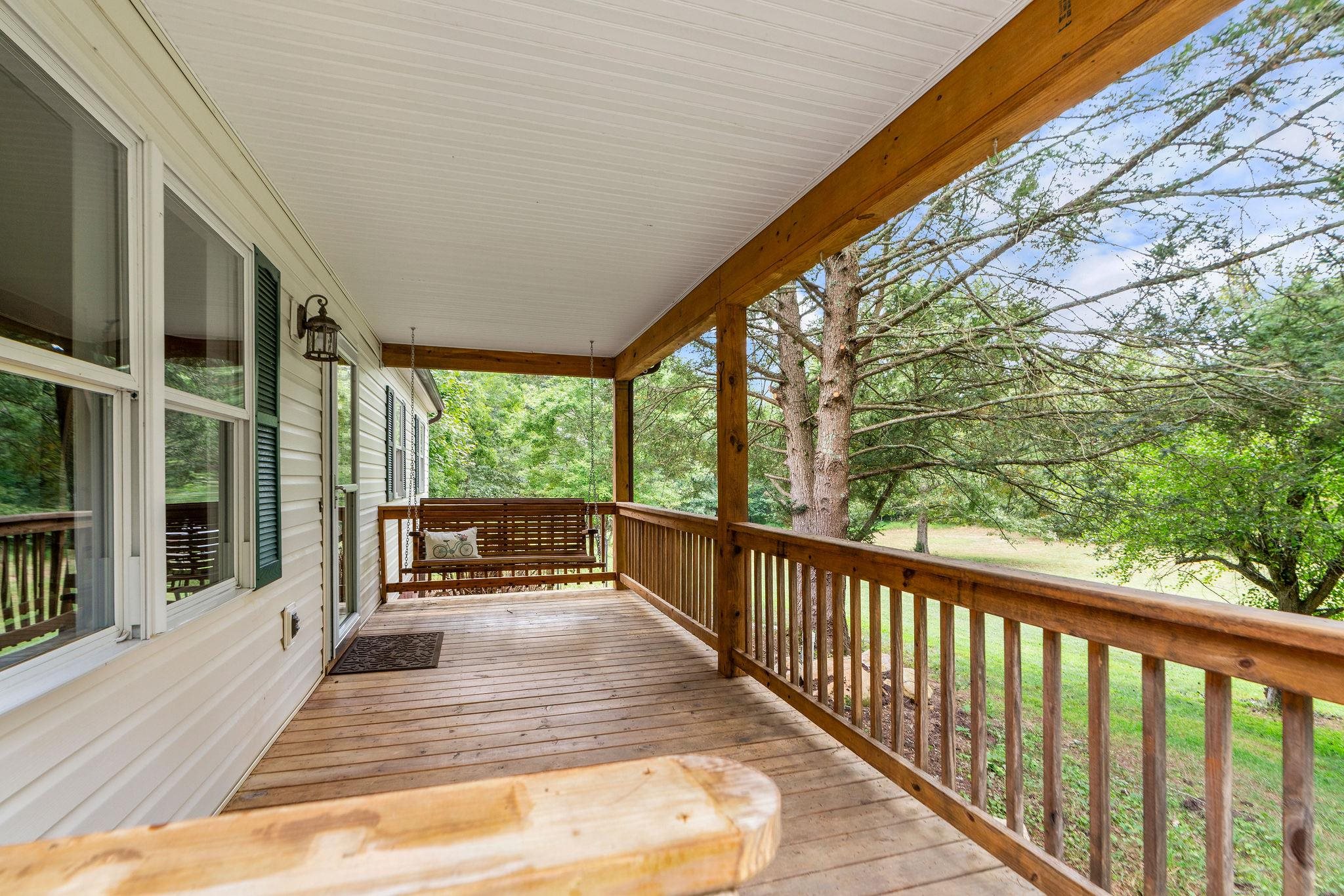 5264 Cold Springs Road Raphine, VA 24472 - Photo 3 of 57 a view of balcony with couch and wooden floor