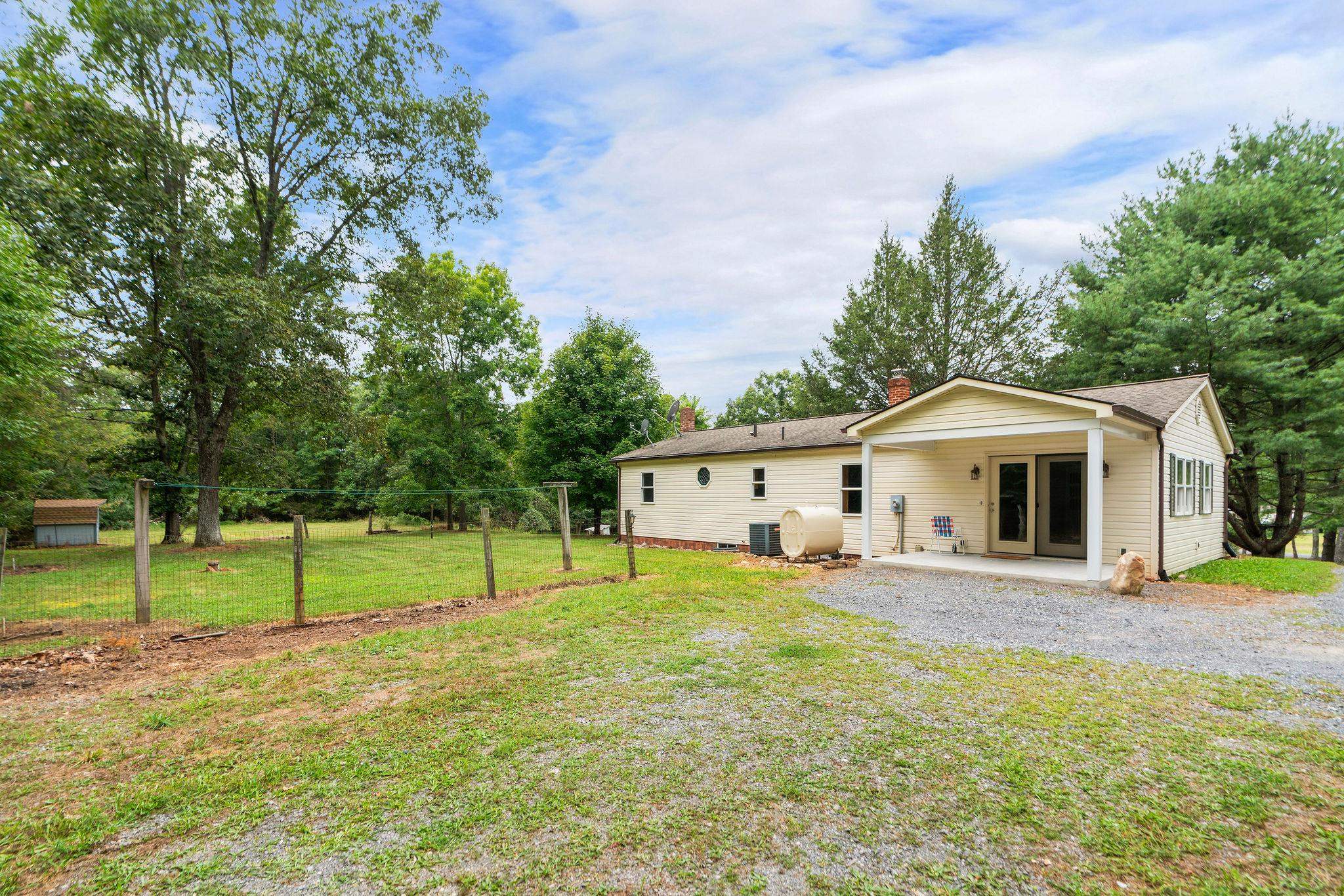 5264 Cold Springs Road Raphine, VA 24472 - Photo 44 of 57 a view of a house with a yard and large trees