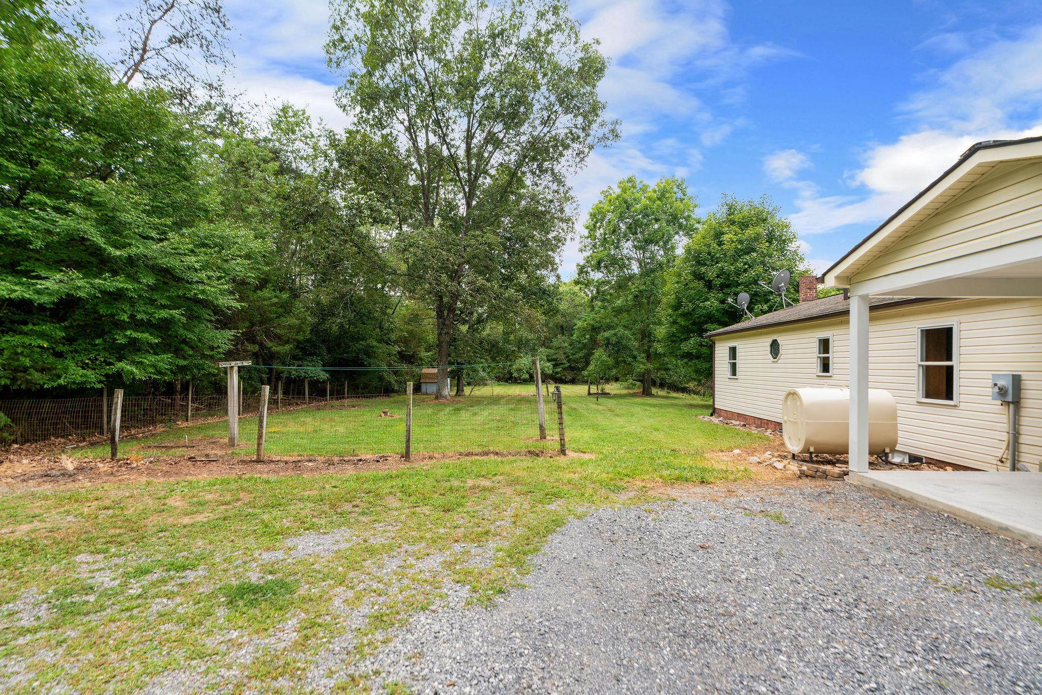 5264 Cold Springs Road Raphine, VA 24472 - Photo 49 of 57 a view of house with backyard and trees