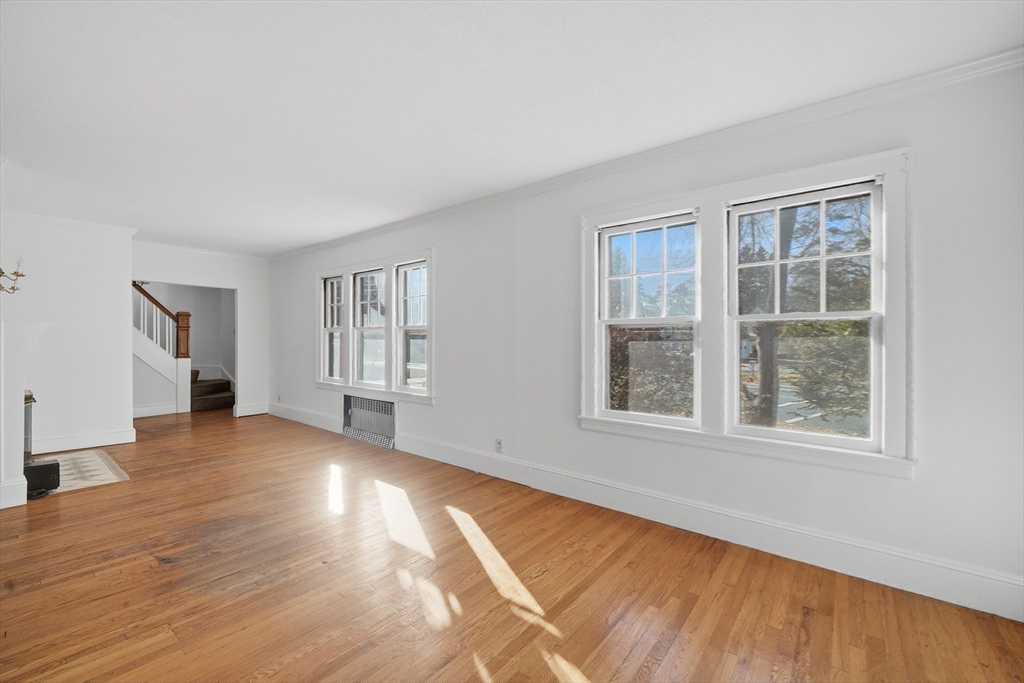 785 Dickinson Street Springfield, MA 01108 - Photo 15 of 36 an empty room with wooden floor and windows