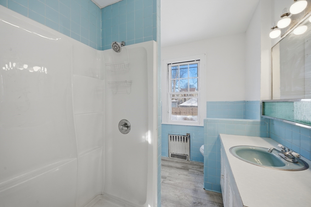785 Dickinson Street Springfield, MA 01108 - Photo 17 of 36 a bathroom with a sink a toilet and shower