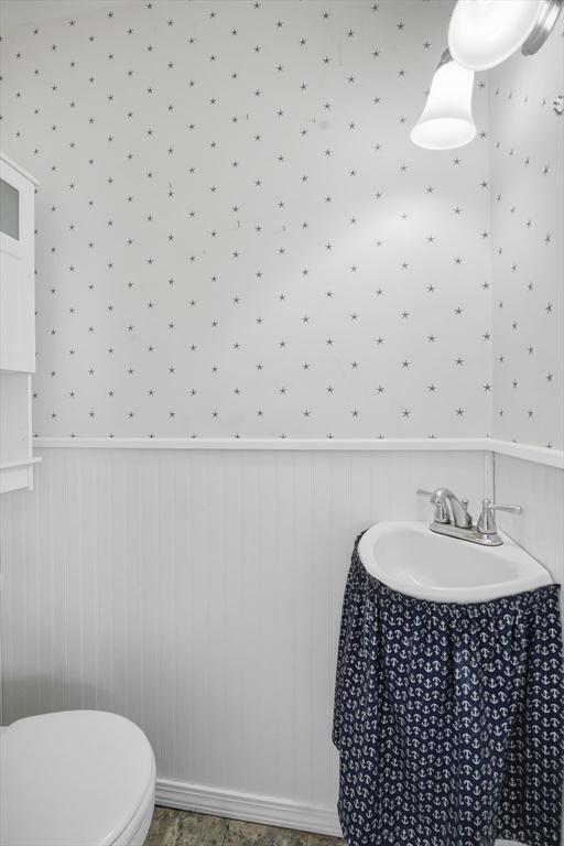 785 Dickinson Street Springfield, MA 01108 - Photo 18 of 36 a bathroom with a sink a toilet and a mirror
