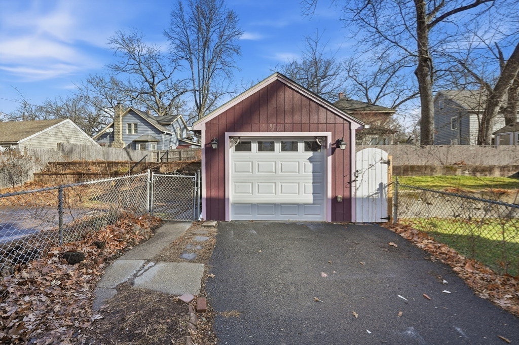 785 Dickinson Street Springfield, MA 01108 - Photo 25 of 36 a view of a house with a yard covered in snow