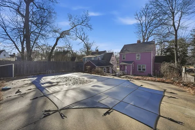 a view of a house with a snow on the road