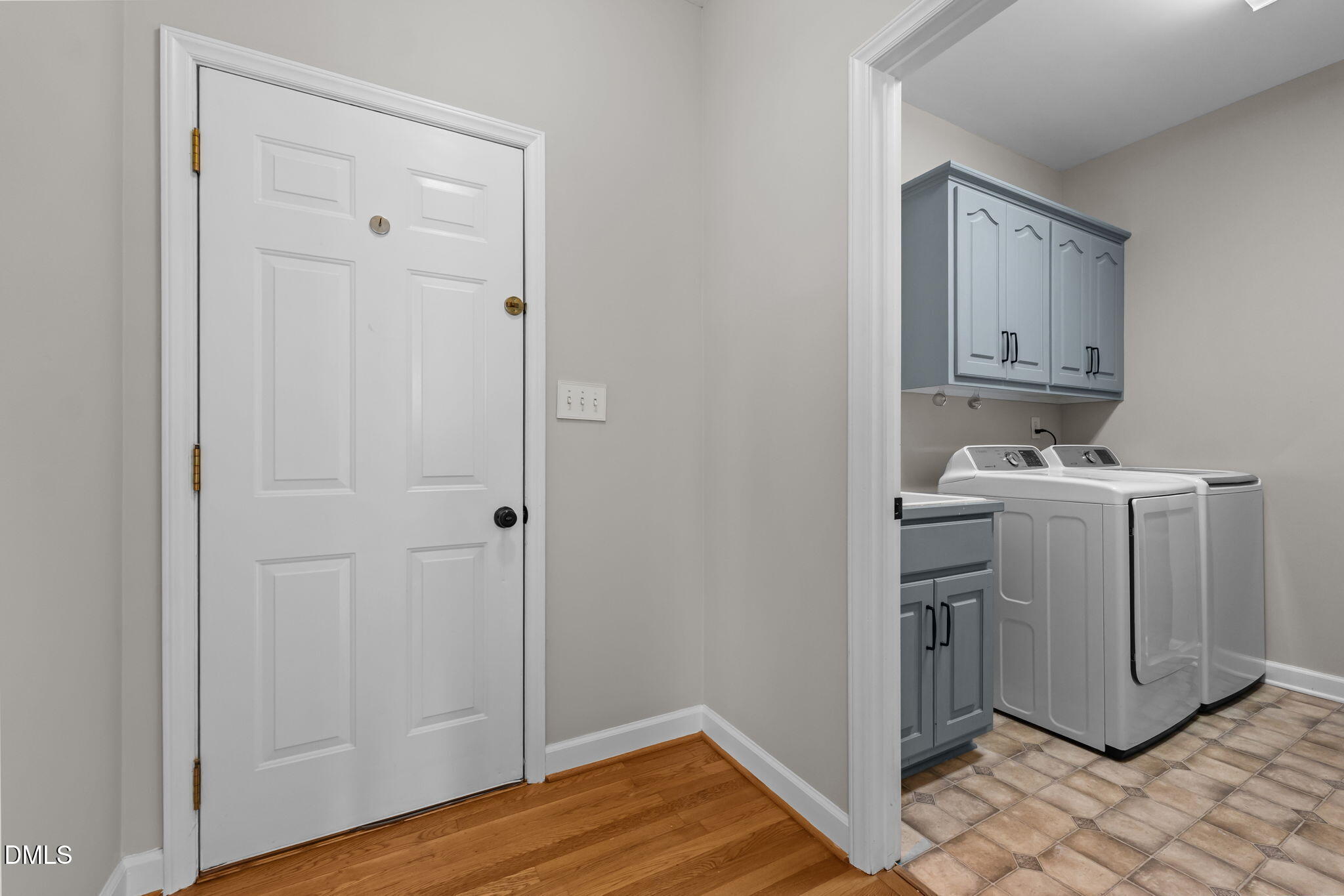 2327 Olde Spring Court Graham, NC 27253 - Photo 21 of 49 a view of cabinets with washer and dryer