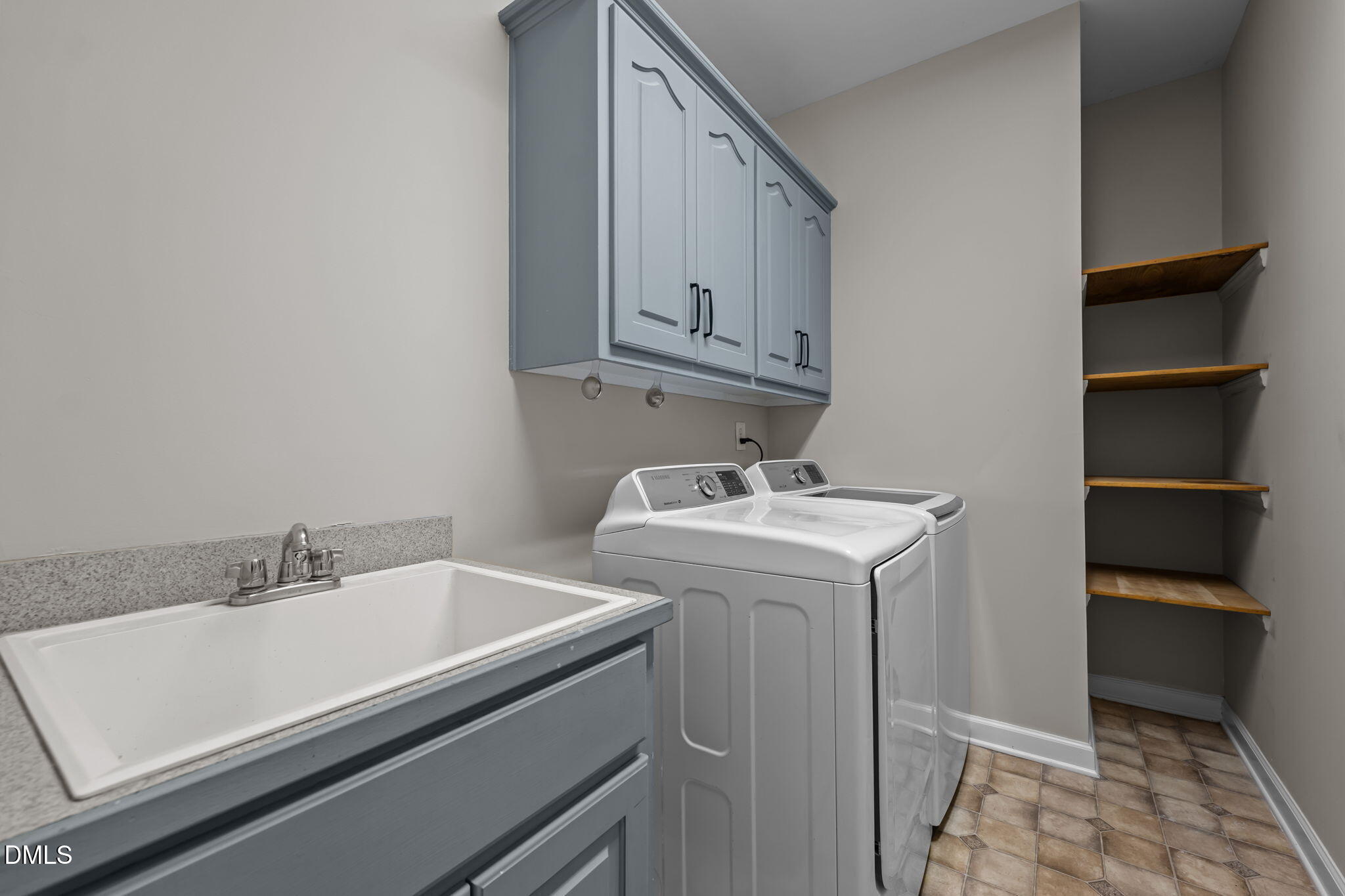 2327 Olde Spring Court Graham, NC 27253 - Photo 22 of 49 a utility room with dryer and washer