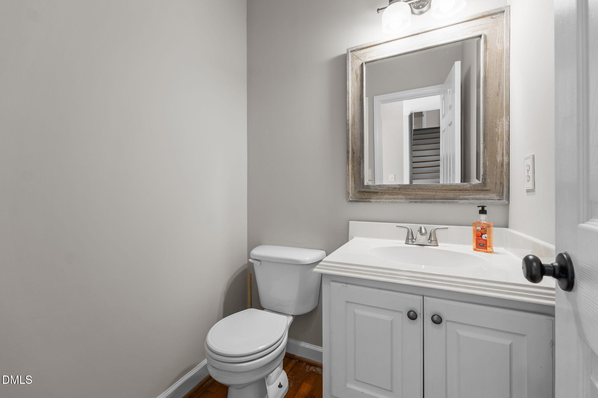 2327 Olde Spring Court Graham, NC 27253 - Photo 23 of 49 a bathroom with a toilet sink and mirror