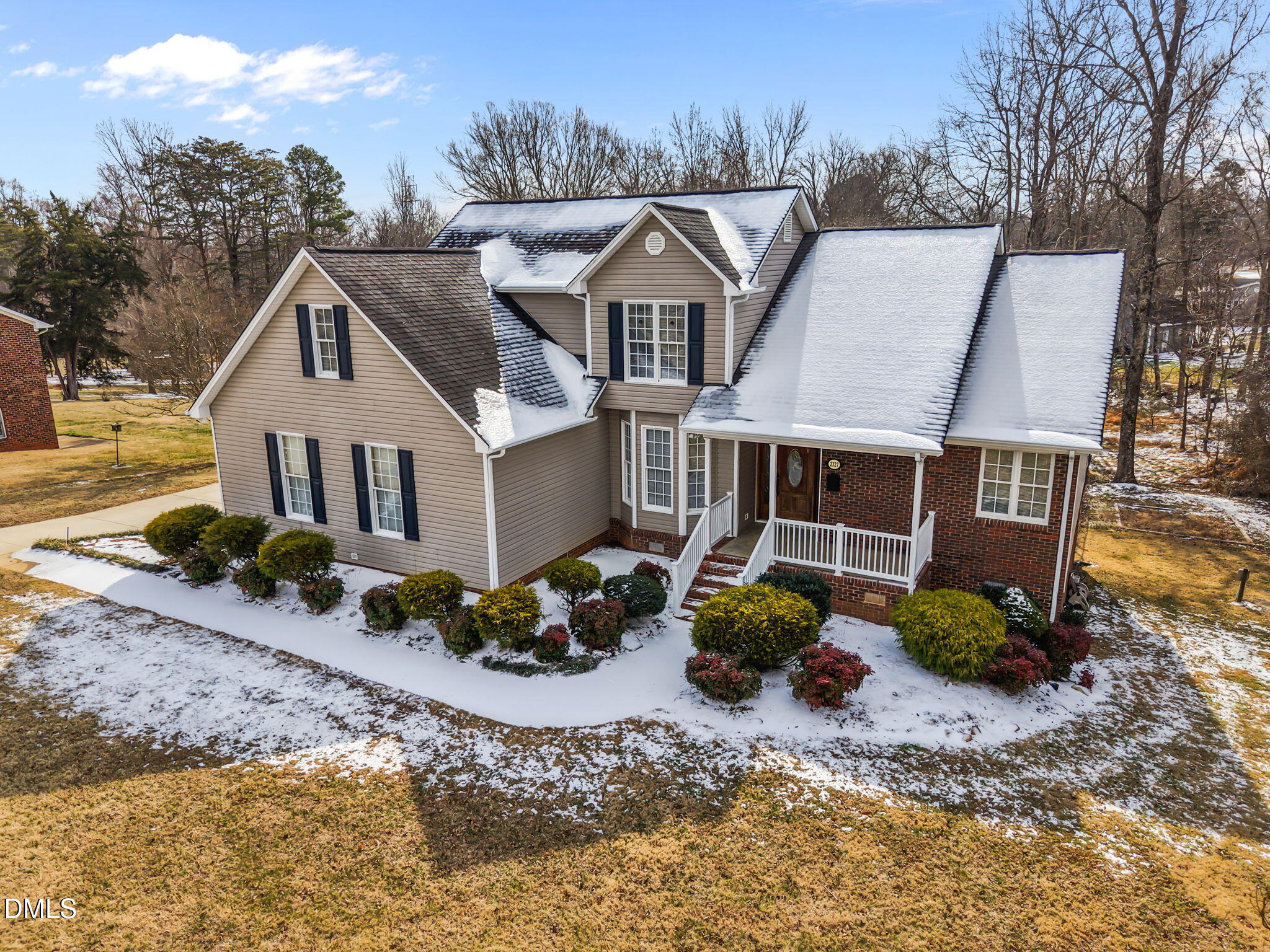 2327 Olde Spring Court Graham, NC 27253 - Photo 3 of 49 a front view of a house with a yard and garage