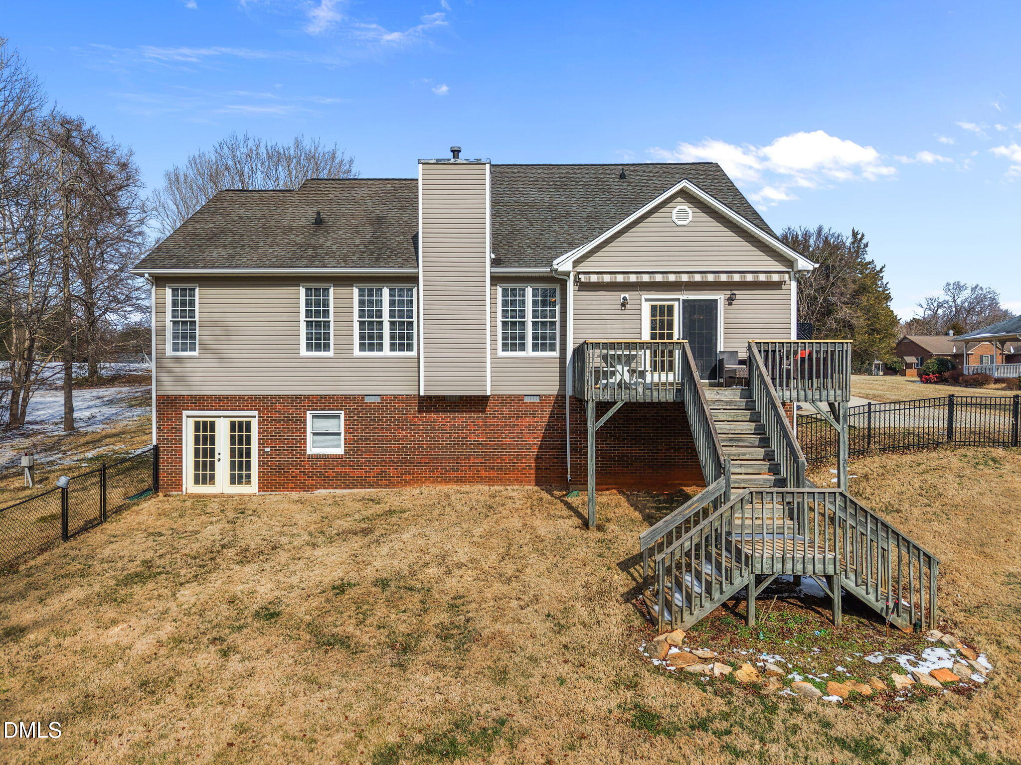 2327 Olde Spring Court Graham, NC 27253 - Photo 41 of 49 a front view of house with yard and trees in the background