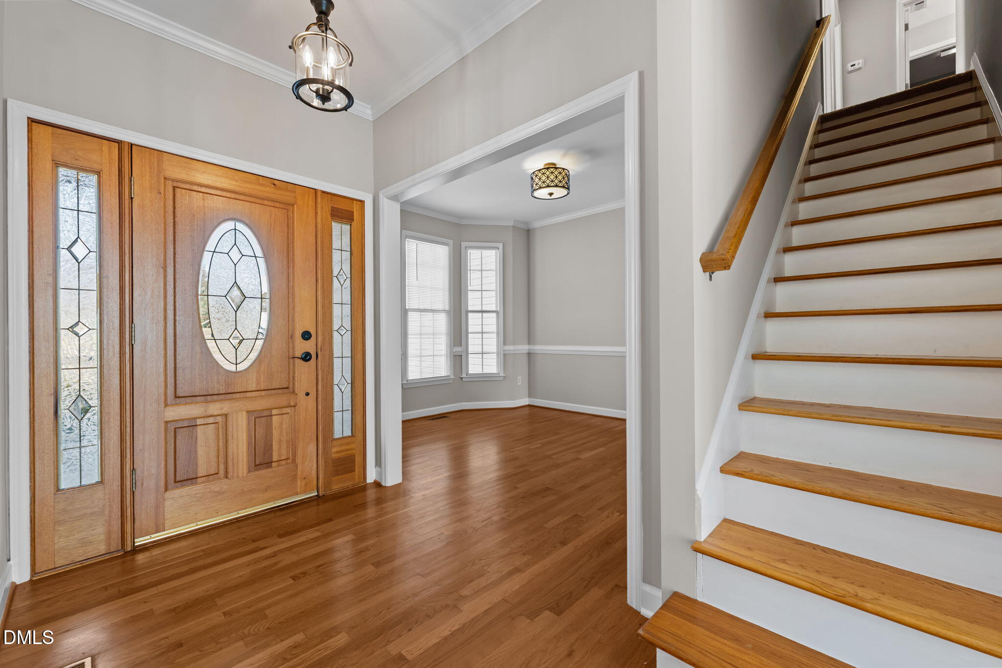2327 Olde Spring Court Graham, NC 27253 - Photo 9 of 49 a view of a hallway with wooden floor and workspace
