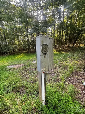 a view of backyard of house with green space