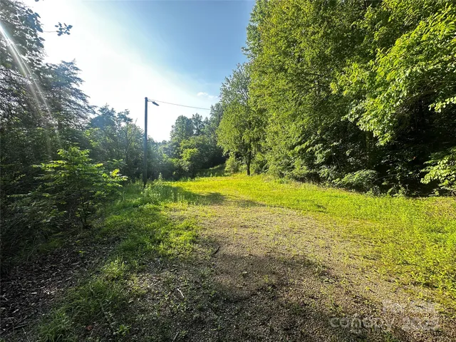 a view of outdoor space with deck and yard